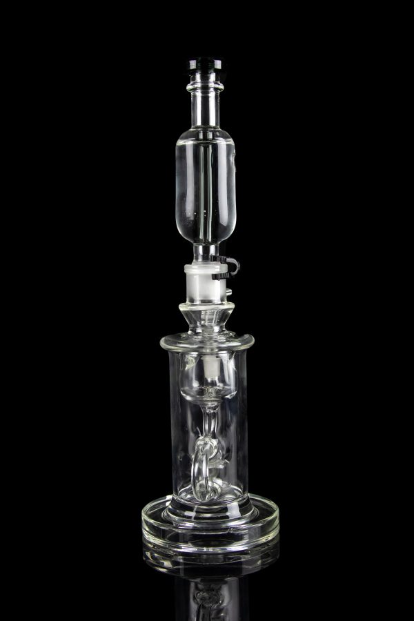 Clear glass dab rig with intricate percolator and bubbler components, isolated on a black background.
