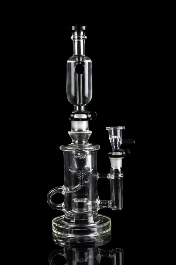 Clear glass water pipe (rig) with intricate branching percolators, against a black background.