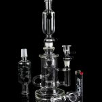 Clear glass water pipe (rig) with multiple chambers and percolators, studio shot.