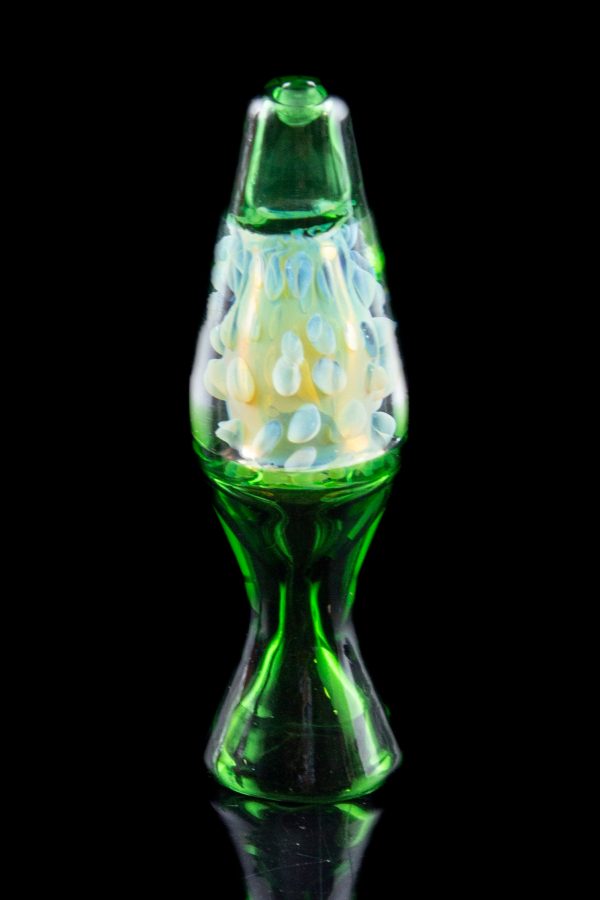 Green glass cannabis oil rig with milky white bubbles.