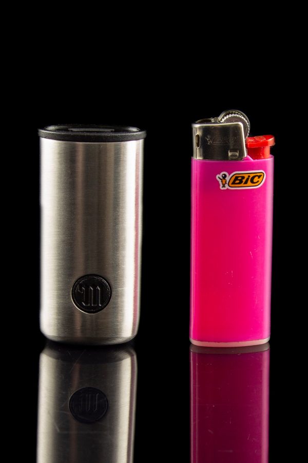 Stainless steel one-hitter pipe and pink Bic lighter on a reflective black surface.