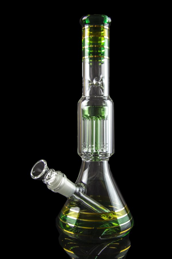 Green glass water pipe with multiple diffusion chambers, isolated on a black background.