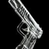 Clear glass pipe shaped like a handgun, reflecting on a black surface.