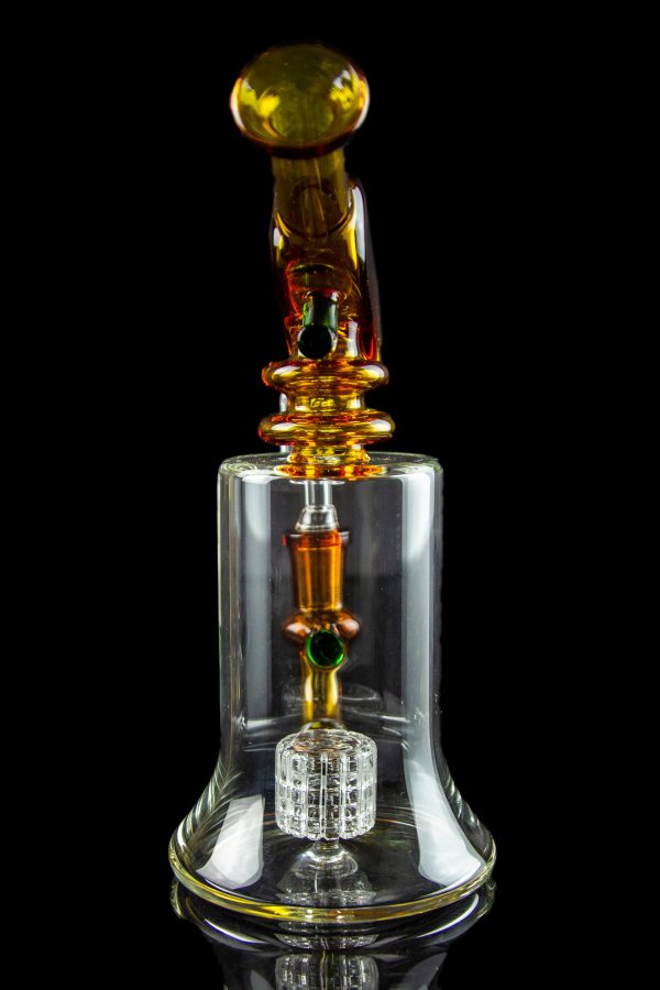 A detailed glass rig with orange and clear glass components, featuring a honeycomb perc diffuser and a spherical mouthpiece, set against a black background.