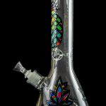 Glass water pipe (bong) with colorful floral designs against a black background.