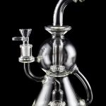 Clear glass water pipe (rig) with intricate bubbler design, isolated on black.