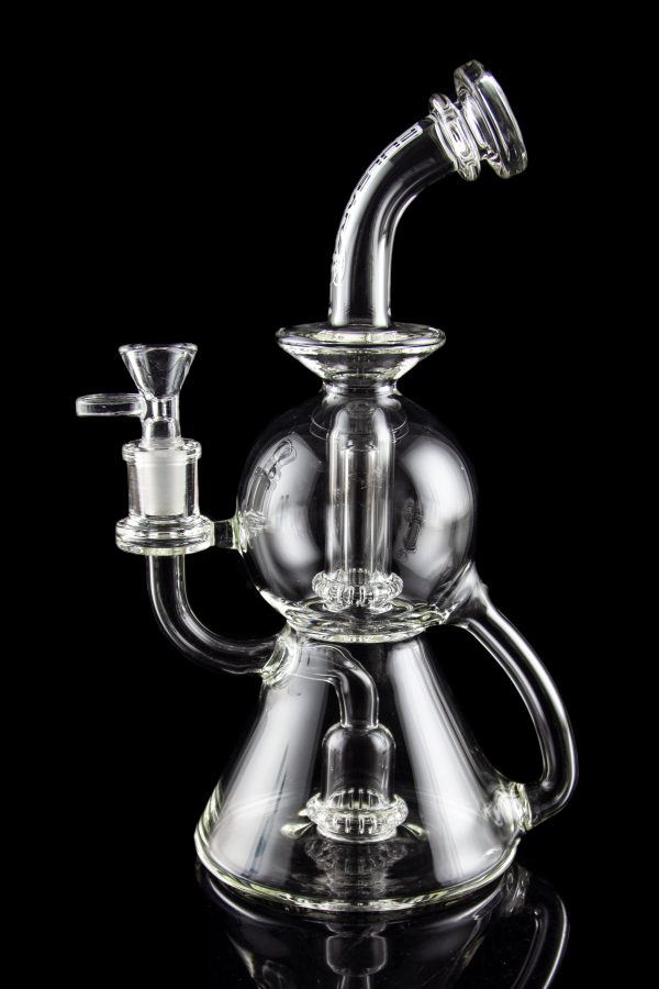 Clear glass water pipe (rig) with intricate bubbler design, isolated on black.