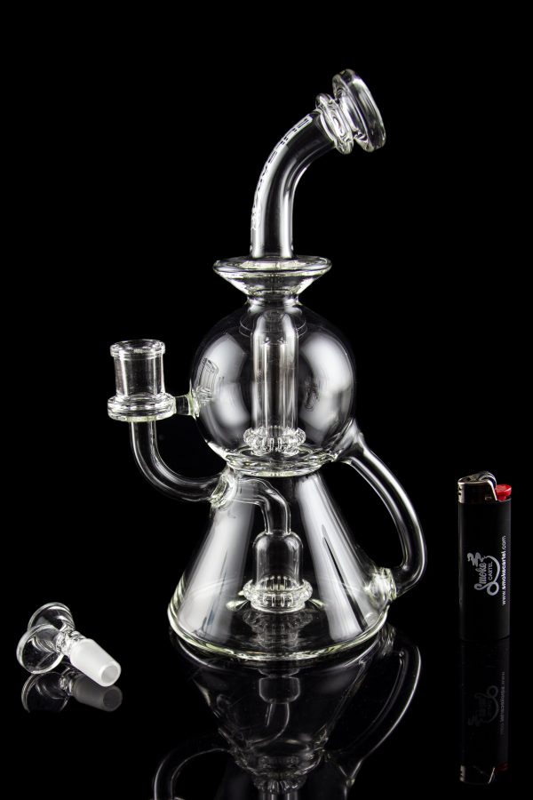 Clear glass water pipe (bong) with multiple chambers and a glass bowl, displayed on a black background.