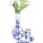 A front view of the “My Bud Vase “Luck” Porcelain Vase Bong”, displaying a white porcelain vase with delicate blue floral detailing.