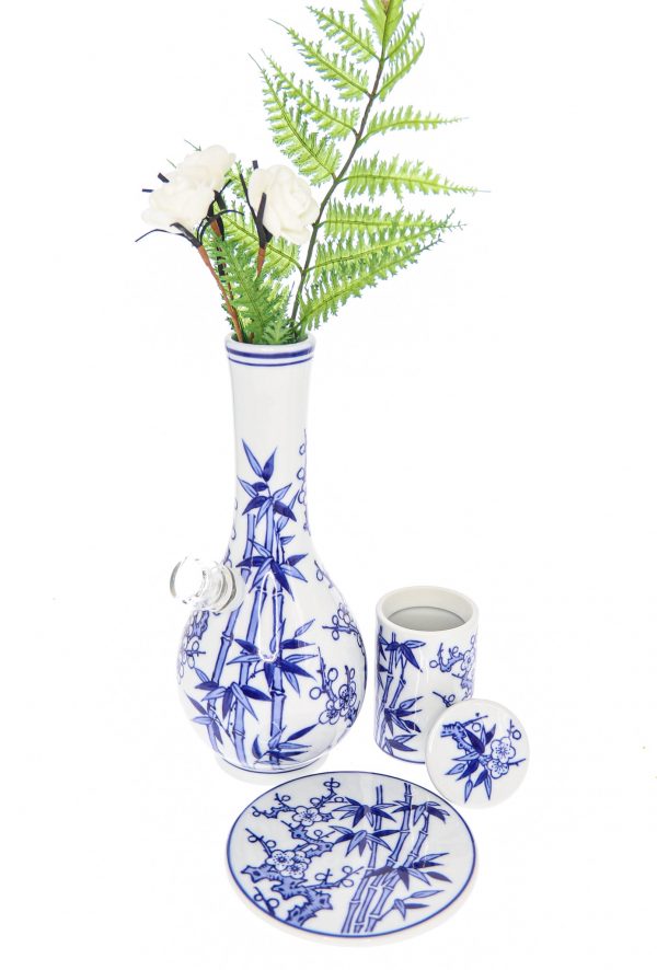A front view of the “My Bud Vase “Luck” Porcelain Vase Bong”, displaying a white porcelain vase with delicate blue floral detailing.