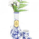 A front view of the “My Bud Vase “Luck” Porcelain Vase Bong” featuring a delicate floral pattern on white porcelain.