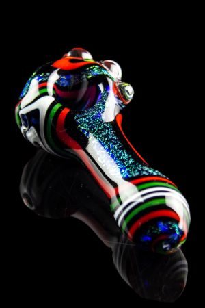 Hand-blown glass pipe with colorful stripes and speckled detailing, displayed against a black reflective surface.