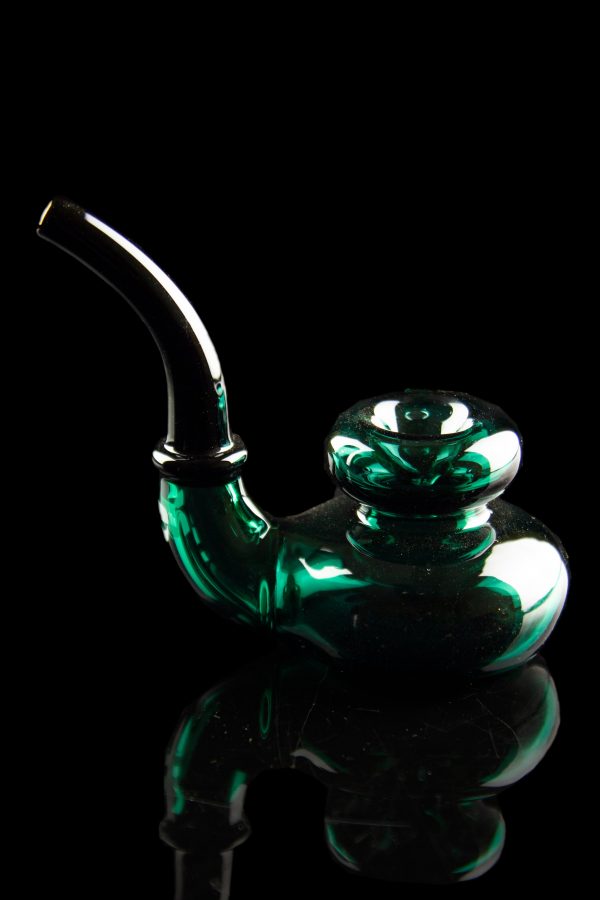 Emerald green glass water pipe against a black background.