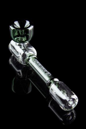 Clear glass cannabis oil rig with green accents, displayed on a reflective black surface.