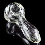 A close-up, angled view of the Pulsar Bubble Matrix Spoon Pipe, showcasing its clear glass construction and bubble detailing.