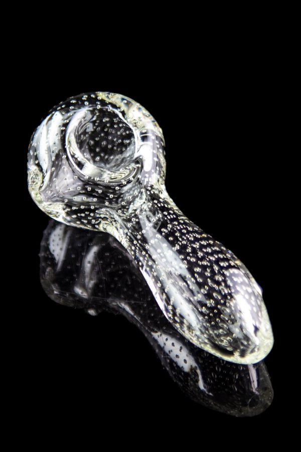 A close-up, angled view of the Pulsar Bubble Matrix Spoon Pipe, showcasing its clear glass construction and bubble detailing.