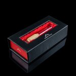 Black gift box containing a rolled cannabis joint with a “Canada Puffin” logo.