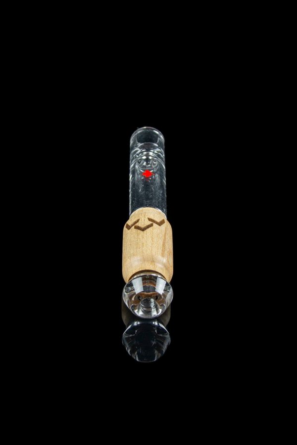 Glass dab rig with wooden accent and clear glass components, isolated on black.