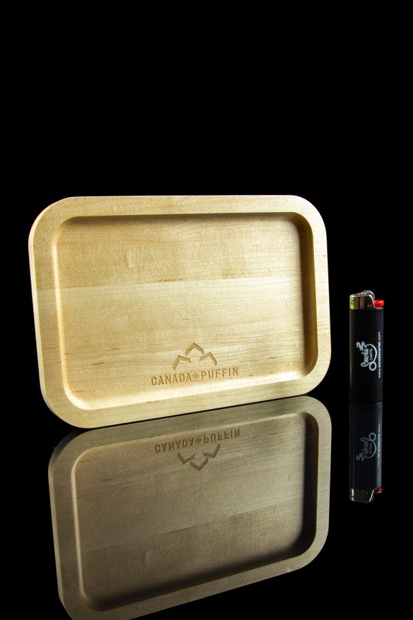 Wooden rolling tray with brand logo and lighter, reflected on a glossy black surface.