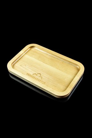 Wooden rolling tray with “Canada Puffin” logo, isolated on black.