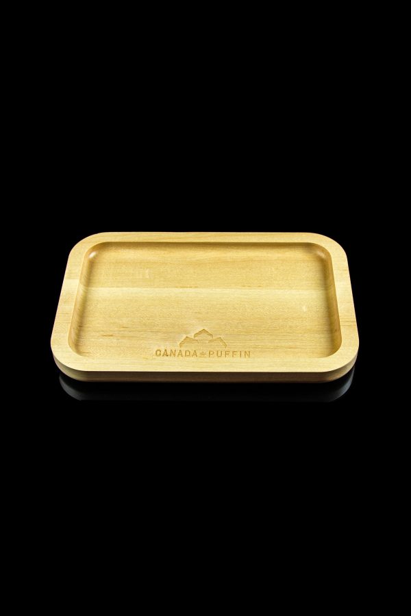 Wooden rolling tray with “Canada Puffin” logo, isolated on black.