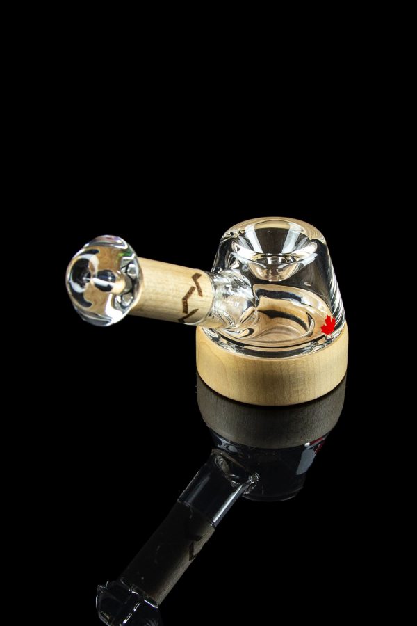 A clear glass bubbler pipe with a wooden mouthpiece, isolated on a black background.