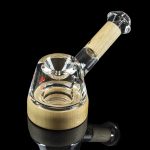 Glass bubbler with a wooden mouthpiece, isolated on black.