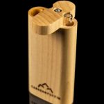 Wooden lighter with cannabis leaf logo and visible flint wheels.