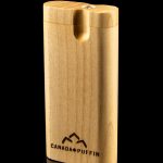 Wooden cannabis pipe with “Canada Puffin” logo and reflective surface.