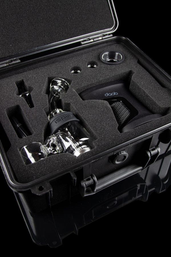 Dab rig and accessories nestled in a protective, foam-lined carrying case.