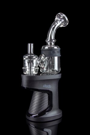 A close-up, angled view of the Ispire Daab E-Rig featuring a dark-colored base and a clear glass bubbler attachment.