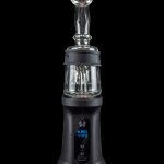 Black cannabis e-rig with a glass water pipe attachment, displaying a temperature of 710°F on its digital screen.