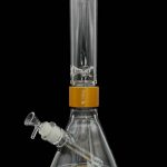 Glass water pipe (bong) with a flared base and intricate percolator, featuring an orange accent band and a clear glass bowl.