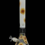 Glass water pipe with sunflower design.
