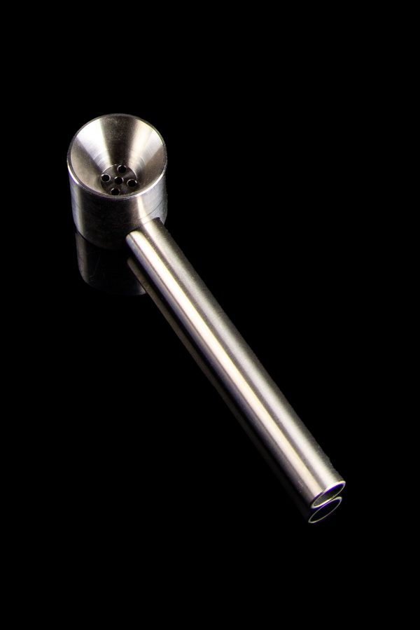 Silver oil burner pipe for cannabis concentrates against a black background.
