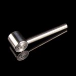 Silver cannabis oil burner pipe with engraved logo on black background.