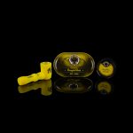 Cannabis oil syringe and branded cartridge packaging with reflective surface.