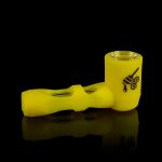Yellow glass pipe with black branding, reflecting on a dark surface.