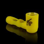 Yellow glass pipe with honeycomb logo against a black background.