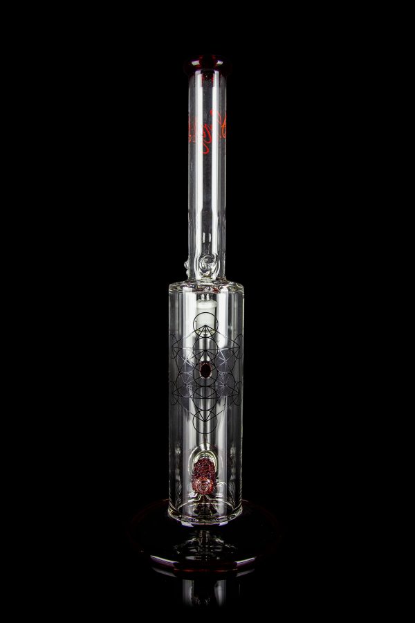 Glass water pipe (bong) with intricate etched design and red accents, isolated on a black background.