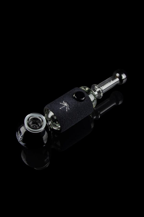 Glass pipe with black, textured wrap and reflective surface, studio shot.