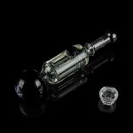 Clear glass dab rig with a quartz banger, isolated on a black reflective surface.