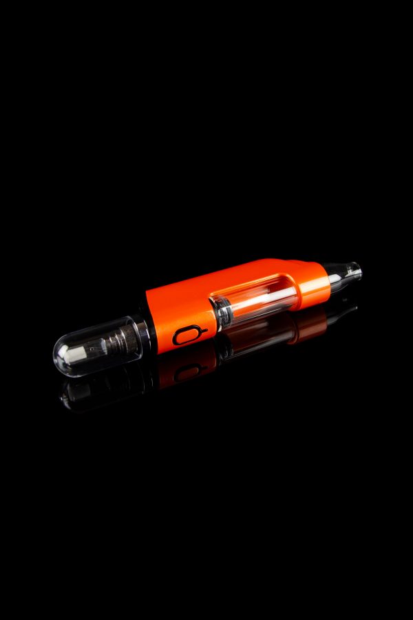 Orange cannabis oil cartridge with clear glass tips against a black background.