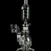 Clear glass water pipe (rig) with a quartz banger, isolated on a black background.