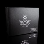 Black box with silver snowflake design and text advertising "Freeze Pipe Recycler" and website "TheFreezePipe.com".