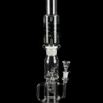 Clear glass water pipe (bong) with intricate branching percolators, against a black background.