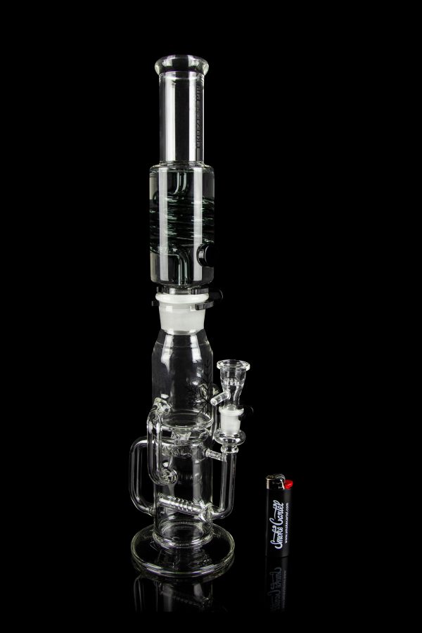Clear glass water pipe (bong) with intricate branching percolators, studio shot on a reflective surface.