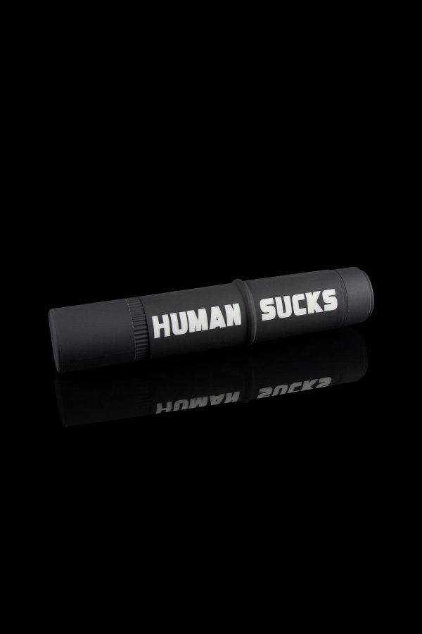 Black cannabis one-hitter pipe and case with white text reading "HUMAN SUCKS".
