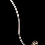 Silver glass cannabis oil burner pipe with a flared mouthpiece, isolated on black.