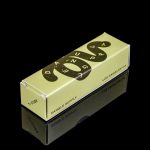 Minimalist packaging for cannabis accessories, featuring a tan box with black “Dangle Supply” logo and “Los Angeles, CA” text, reflected on a glossy black surface.